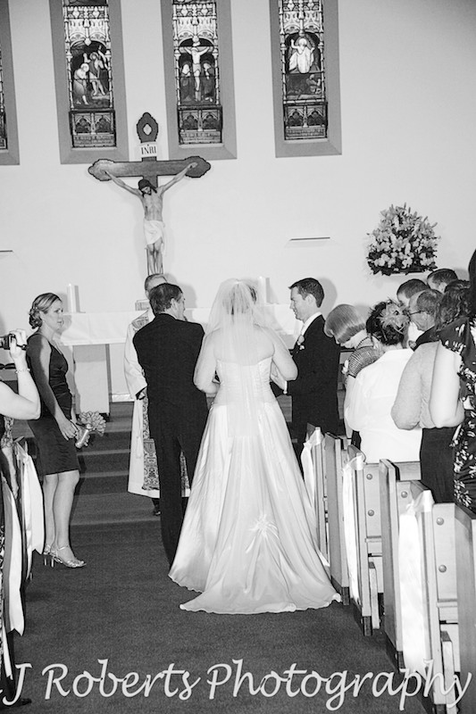 Father of the bride handing over her hand in marriage - wedding photography sydney